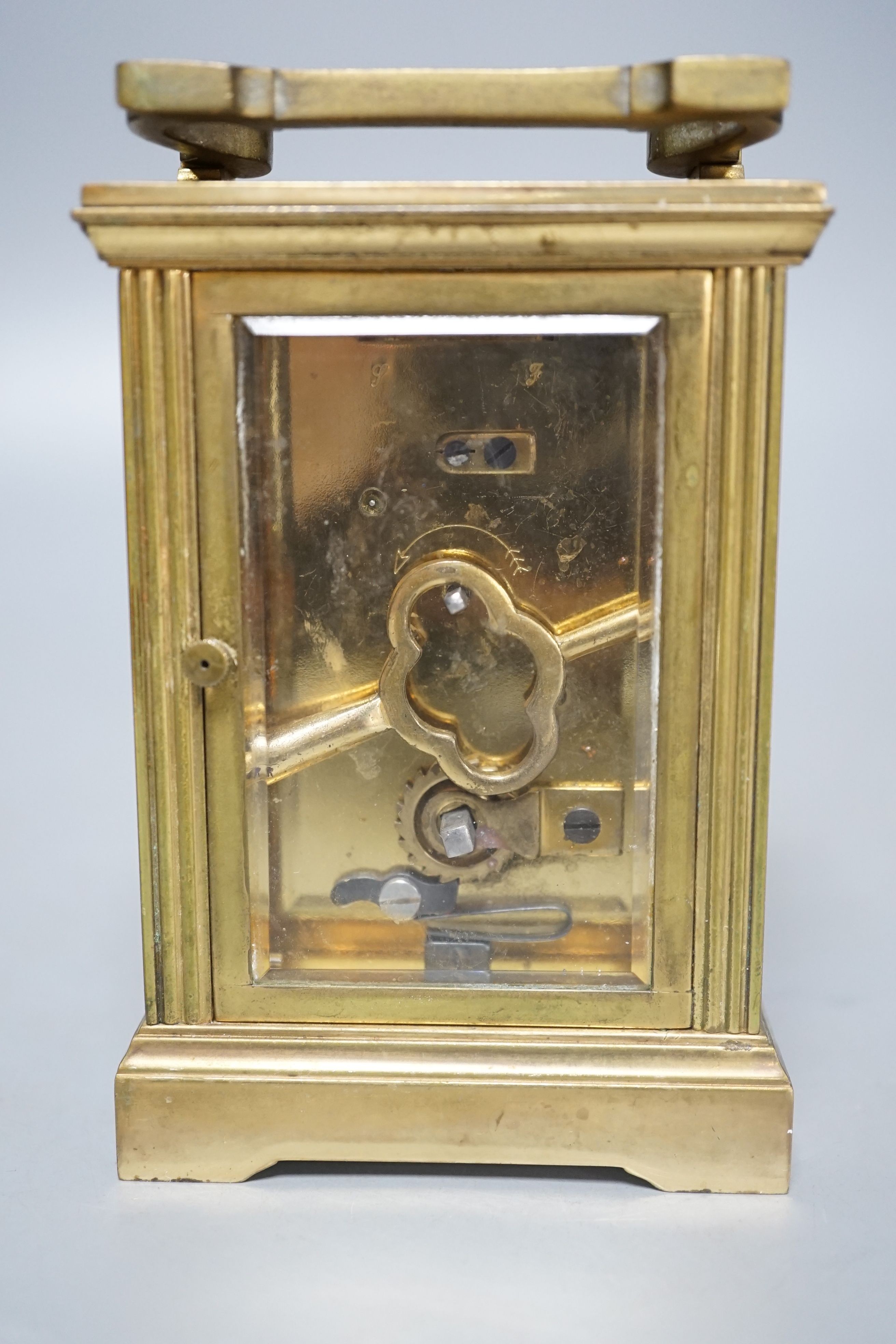 A French brass carriage timepiece, 11cms high.